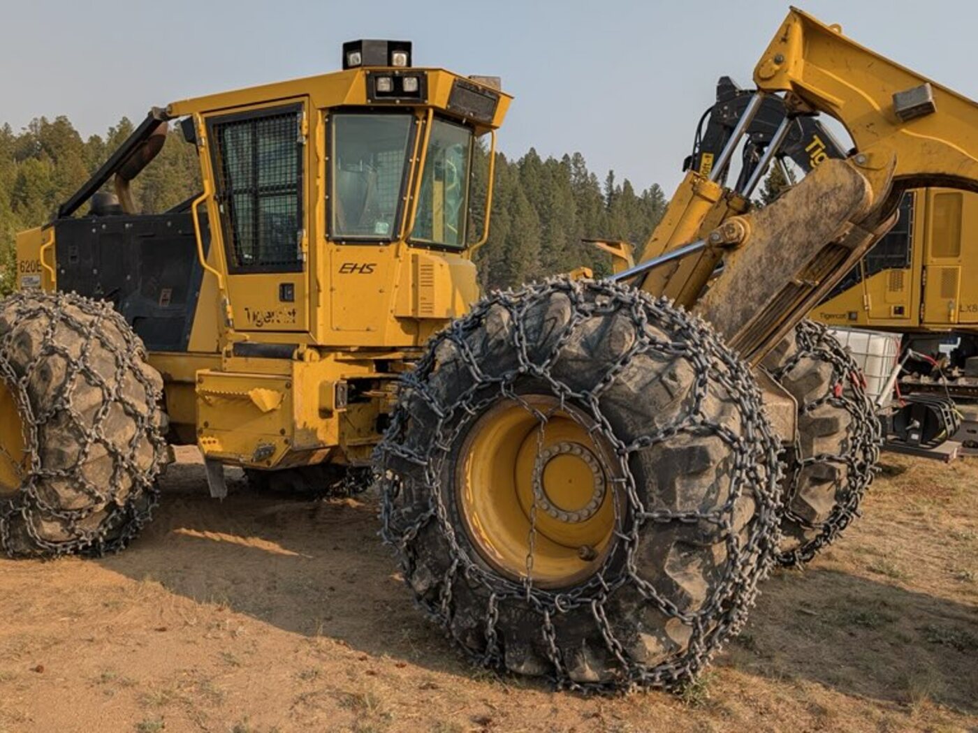 Tigercat 620E grapple skidder with the grapple raised on a Montana clearing job