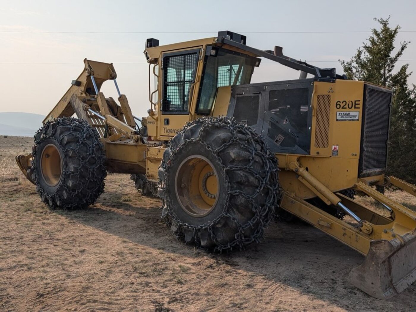 Side profile of Over The Top's Tigercat 620E grapple skidder